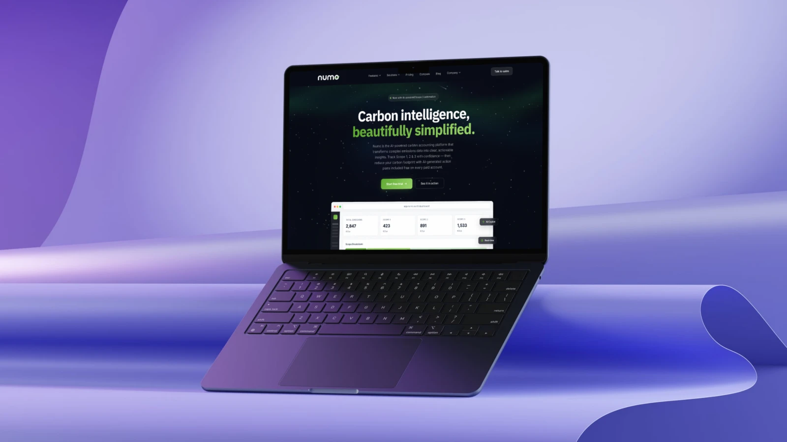 The Numo Earth carbon accounting platform on a laptop, showing the emissions dashboard with Scope 1, 2 and 3 totals.
